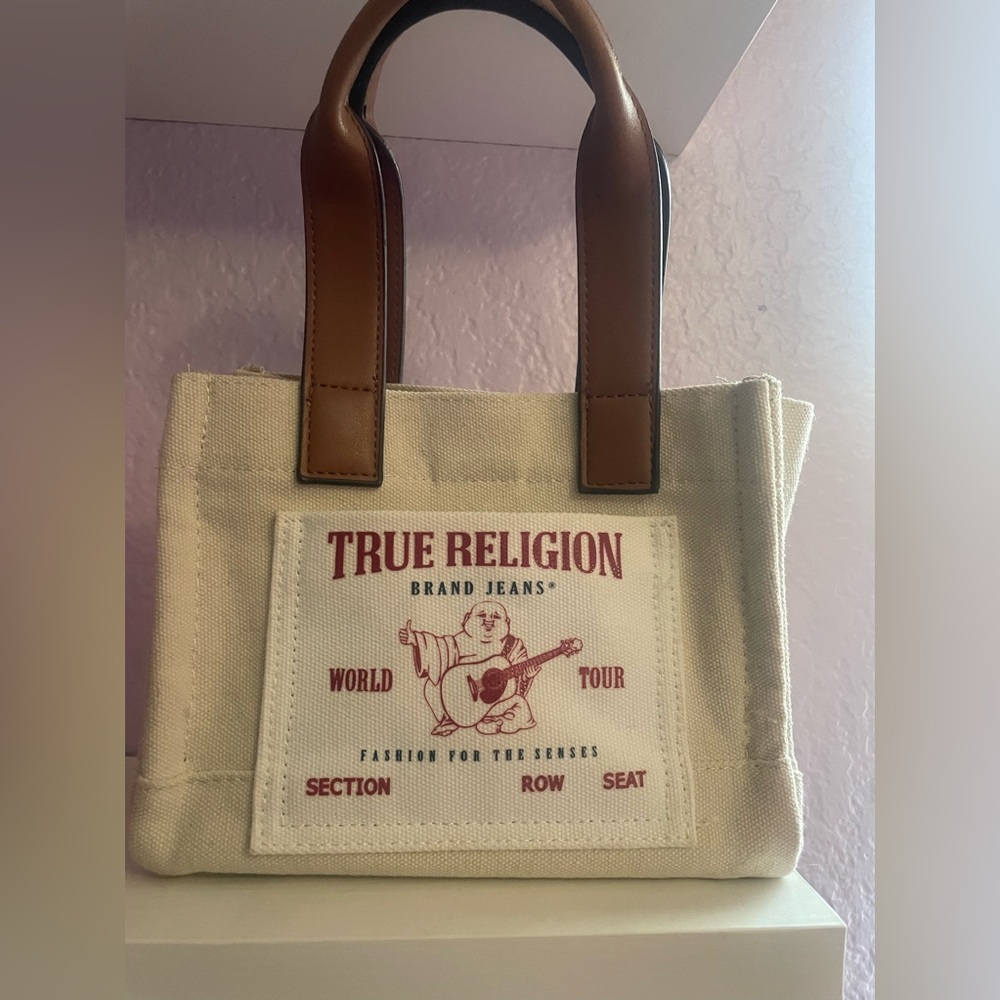 Small true religion bag, new never used.